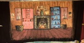 Cuisine avec buffet, plancher et feu dans l'âtre